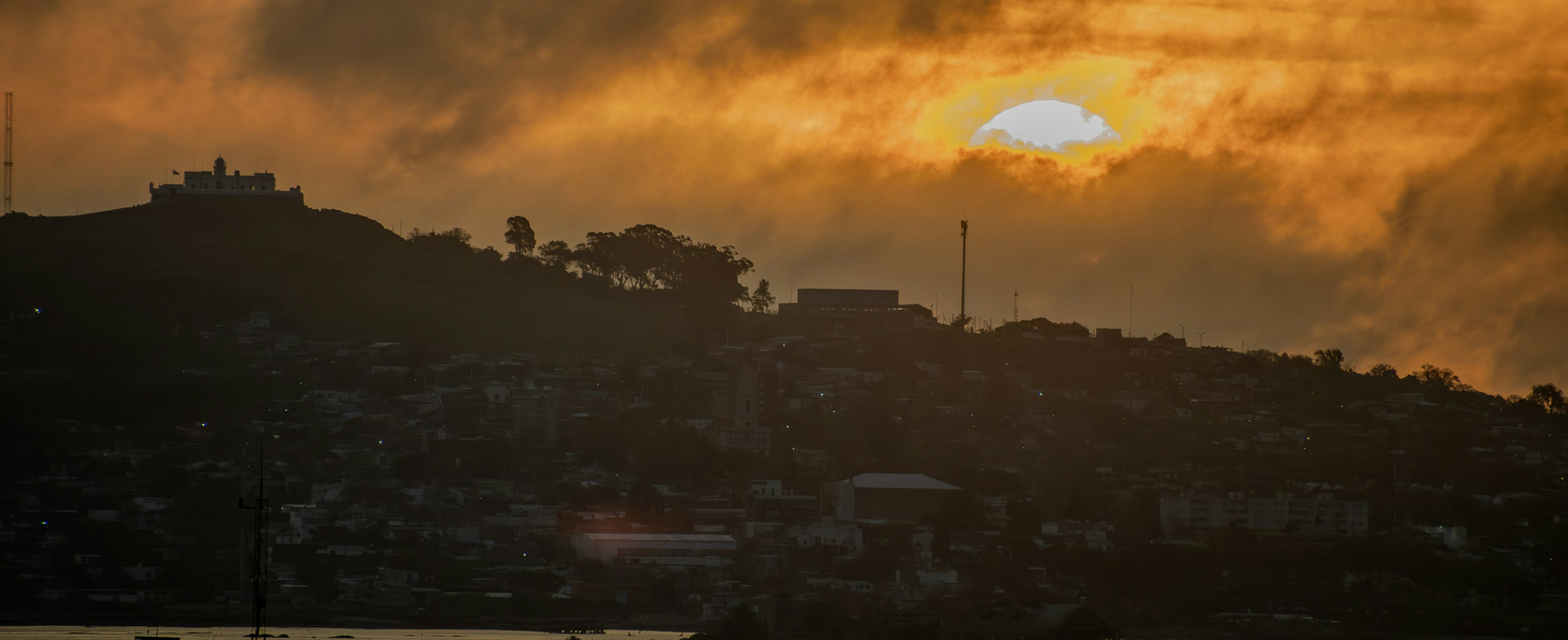 Hilltop monastery silhouette in Bzommar at sunset